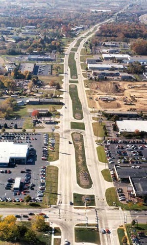 aerial photo of a long street that shows dedicated left turn lanes