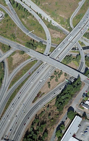 aerial photo of intersecting highways and interchanges