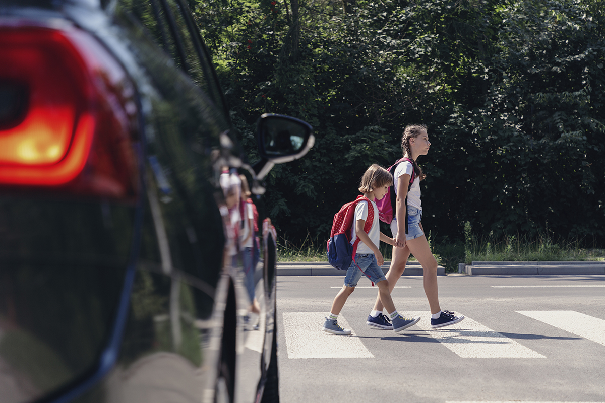 two children in a pedestrian crossing