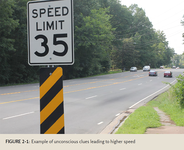 Photo of a road with a speed limit 35 sign - The intended speed of this road is 35 miles per hour, but the wide design of the road and the number of lanes leads drivers to drive much faster.