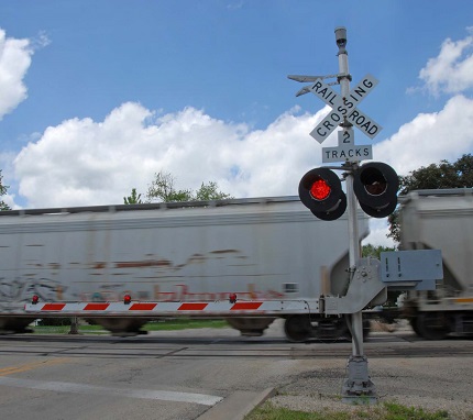 a train traveling across a railroad crossing